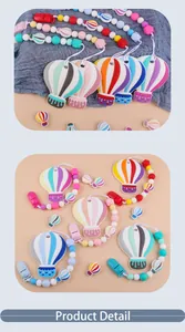 Detailed view of colorful silicone hot air balloon pacifier clips with safety beads