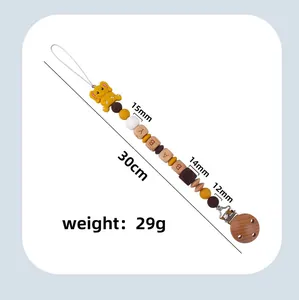 Detailed view of 30cm silicone baby elephant pacifier clip with baby text beads