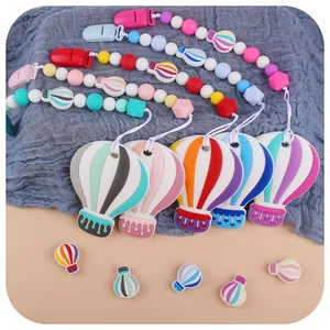 Silicone pacifier clip set with hot air balloon teething toys in pastel colors