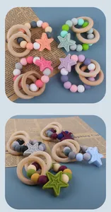 Macro detail of silicone baby teether with wooden rings and colorful star beads