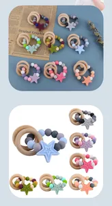 Detail of baby teething bracelet with star silicone beads and natural wooden rings
