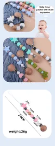 Detail view of silicone baby pacifier chain with star beads and wooden clip for teething