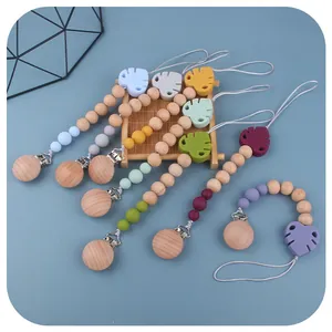 Handmade beech wood and silicone leaf pacifier clip in various Morandi colors
