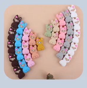 Detail of colorful silicone sheep charms for DIY baby pacifier clips and teething bracelets