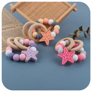 Silicone star teether with natural wood rings for baby sensory and teething relief