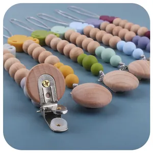 Silicone and beech wood baby pacifier clip with anti-drop chain and metal clip attachment