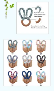Detail of hand-woven cotton bunny ears and natural beech wood baby teething ring
