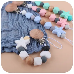 Baby silicone pacifier clips with star beads and wooden clasp in pastel colors
