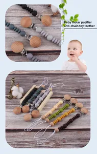 Detail of baby molar pacifier clips featuring beech wood and colorful silicone beads