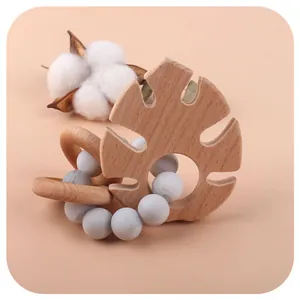 Bracelet de dentition bébé en silicone et hêtre avec feuille et perles marbre