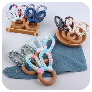 Natural beech wood teething ring with handmade cotton rabbit ears for baby sensory play