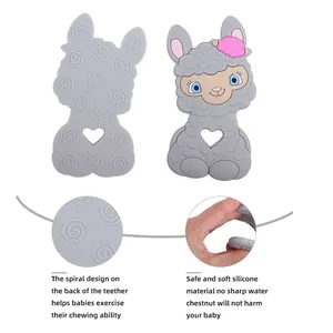 Safe silicone baby teether with cartoon sheep design featuring dual-sided textures for chewing