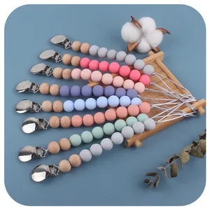 Silicone and wood baby pacifier clip chain set in eight assorted soft pastel colors