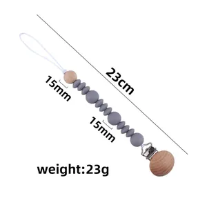 Silicone and beech wood baby pacifier clip with dimensions of 23cm length and 23g weight
