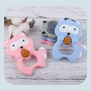 Detail of cartoon raccoon silicone baby teether showing easy-grip hollow ring design
