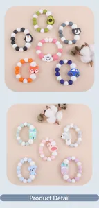 Detail of colorful silicone baby teether bracelets with cute cartoon animal pendants