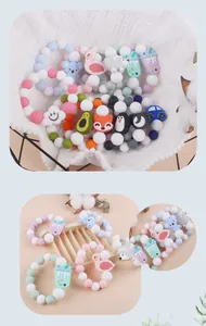 Detail view of silicone baby teething bracelets with assorted cartoon animal pendants