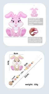 Macro detail of food-grade silicone bunny teether and pacifier clip in pink and brown