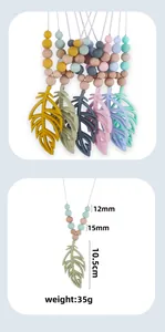 Silicone leaf baby teether necklace with detailed size measurements and pastel beads