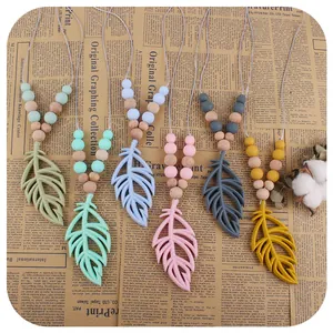 Silicone feather baby teething necklaces in six colors with natural wood beads decoration