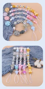 Detail of personalized silicone pacifier clip with cartoon koala and name beads