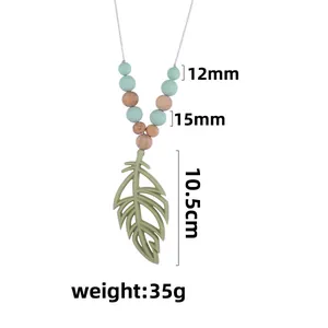 Silicone feather baby teether necklace with 10.5cm pendant and colorful sensory beads