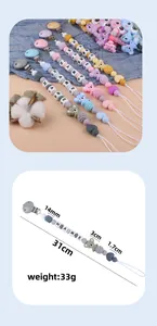 Detailed view of silicone pacifier clip with koala decor and size measurements shown