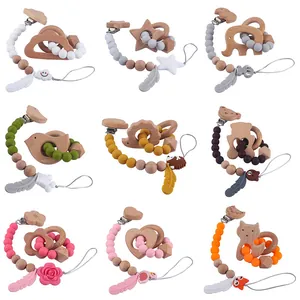 Baby-Beißring-Set aus Silikon und Buchenholz mit Tiermotiven und Schnullerketten