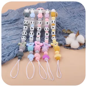 Silicone baby pacifier clips with koala charms and letter beads in five vibrant colors