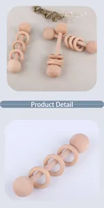 Detailed macro view of natural beech wood baby rattle with sliding rings and smooth texture