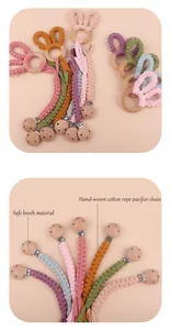 Detail of hand-woven cotton pacifier clip with safe beech wood and cute rabbit ears