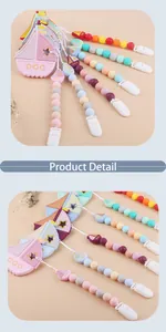 Close-up of silicone sailboat teether and pacifier clip with colorful beads