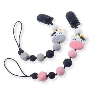 Sujeta chupetes de silicona para bebé con diseño de vaca y cuentas rosa y gris