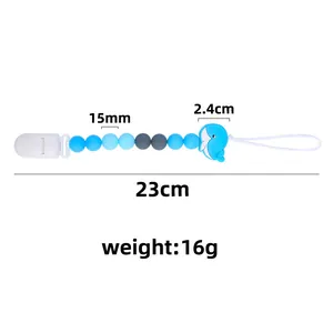 Sujeta chupetes de silicona con ballena azul y cuentas grises, largo de 23cm