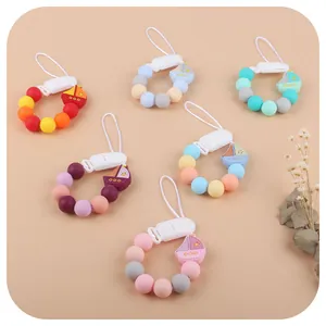 Silicone baby pacifier clips with sailboat charms and colorful beads in various styles