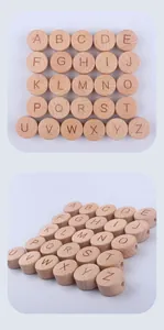 Macro shot of 15mm round beech wood beads with engraved A-Z alphabet and side holes