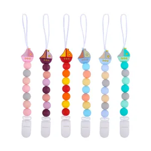 Set of 6 colorful silicone baby pacifier clips with cartoon sailboat and safety beads