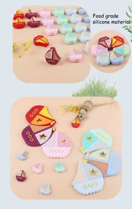 Detailed view of colorful sailboat-shaped silicone teething beads for baby DIY craft
