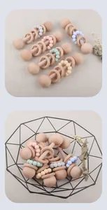 Close-up of baby teether with natural beech wood rings and morandi silicone beads