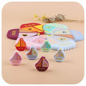 Colorful silicone sailboat baby teether set with puzzle blocks and textured surfaces