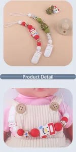 Detail showing silicone pacifier clips with snowman and Christmas tree charms
