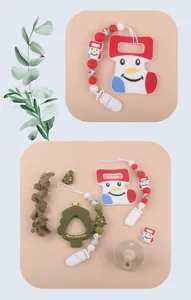 Close-up of Christmas silicone teething set with snowman sock and tree beads