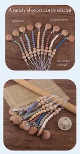 Close-up of beech wood pacifier clip with baby engraving and colorful silicone beads