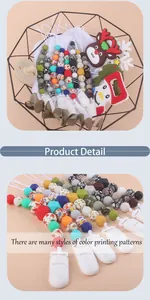 Close-up of printed silicone beads and holiday-themed baby teether clips in a basket