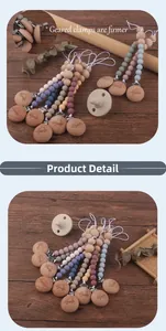 Detail of baby pacifier clip with Morandi silicone beads and engraved beech wood clamp