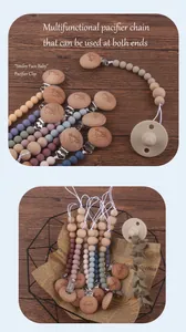 Detail of wooden baby pacifier clip with smiley face engraving and colorful silicone beads