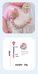 Detailed view of baby pacifier clip with dimensions 26cm and beech wood beads