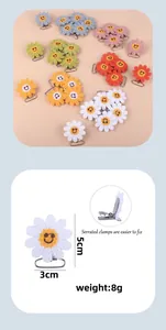 Detailed view of 5cm crochet sunflower pacifier clip with secure serrated metal clamp