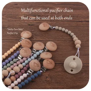 Handmade beech wood and silicone baby pacifier clip with smiley face beads and metal clasp