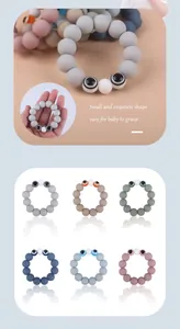 Silicone baby teether ring with acrylic eyes in Morandi colors for easy infant grasping